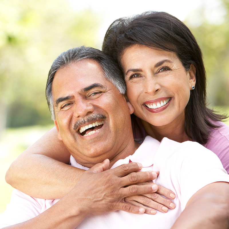Husband and Wife Holding each other and Laughing and Smiling