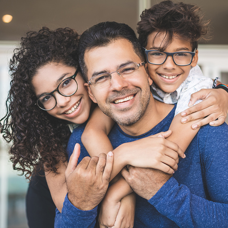 Family Smiling sitting on porch