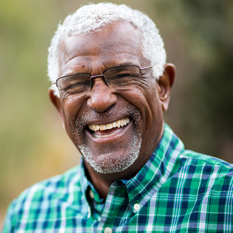 Elderly Man Laughing and smiling at Camera