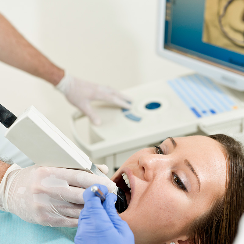 Woman Getting Teeth Checked Out by Dentist