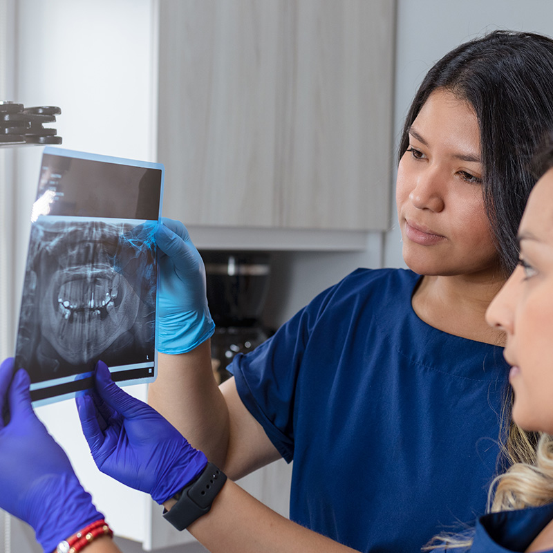 Dental Assistants Looking at Xray