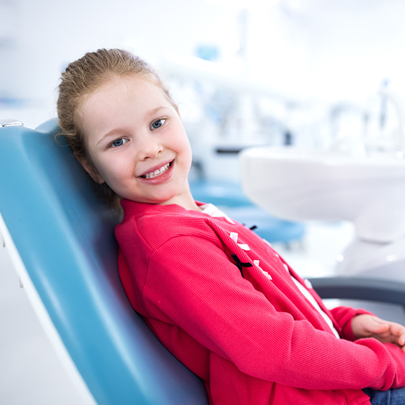 Child Sitting in Dentist Chair